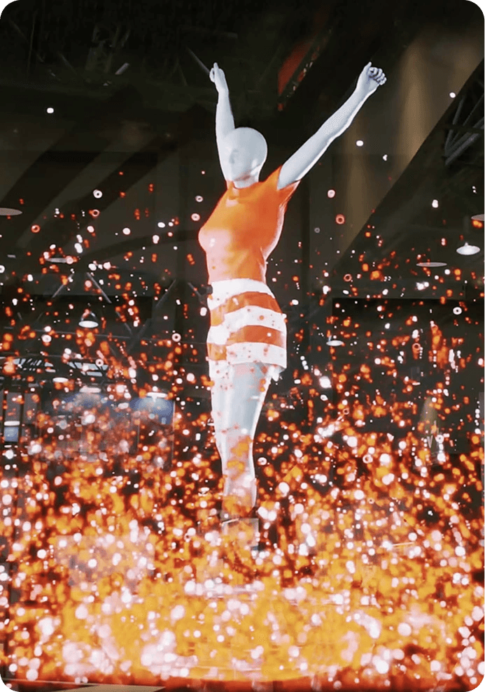 Holographic figure of a dancer above a shower of sparks