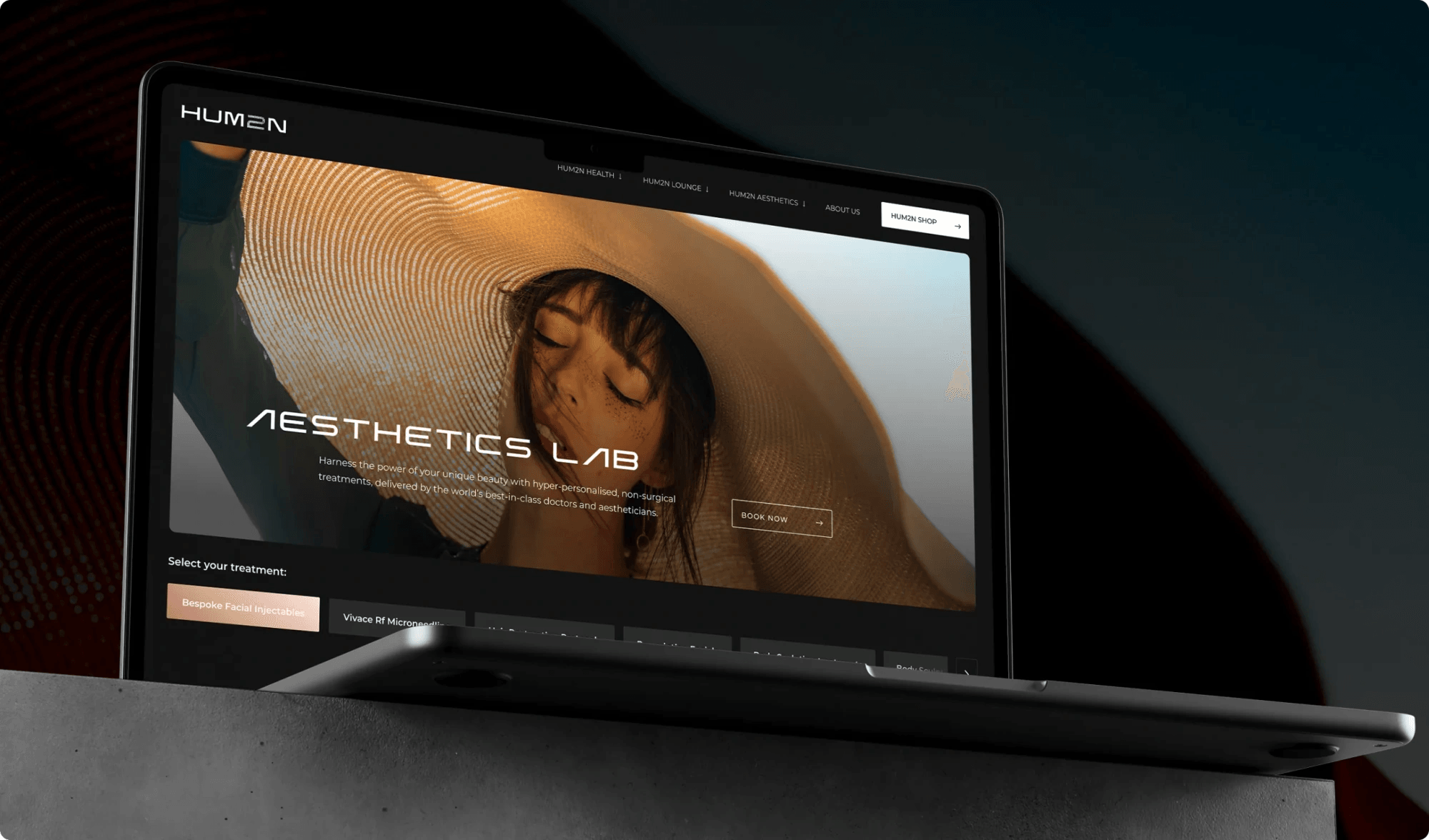 HUM2N Aesthetics Lab page on a laptop